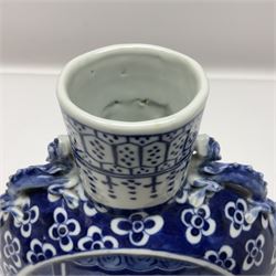 Chinese blue and white moon flask vase, the central panel depicting figures, bordered by floral decoration, with lizard handles to each shoulder, upon an oval foot, H25cm