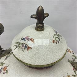 Wong Lee, twin handled ceramic urn with enamelled floral decoration and bronzed metal mounts, upon a square base, marked to base, together with similar twin handled urn with enamelled Cherub decoration, largest H44cm