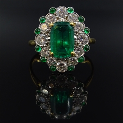  Oval emerald and diamond gold cluster ring, with emerald border hallmarked 18ct, emerald approx 1.9 carat, diamonds approx 1 carat  