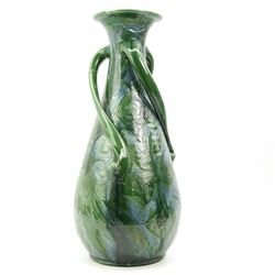 C.H. Brannam Barnstaple art pottery vase, baluster form, with three twisted scroll handles, incised with birds amongst flowers in blue green glaze, incised marks, dated 1905, H53cm