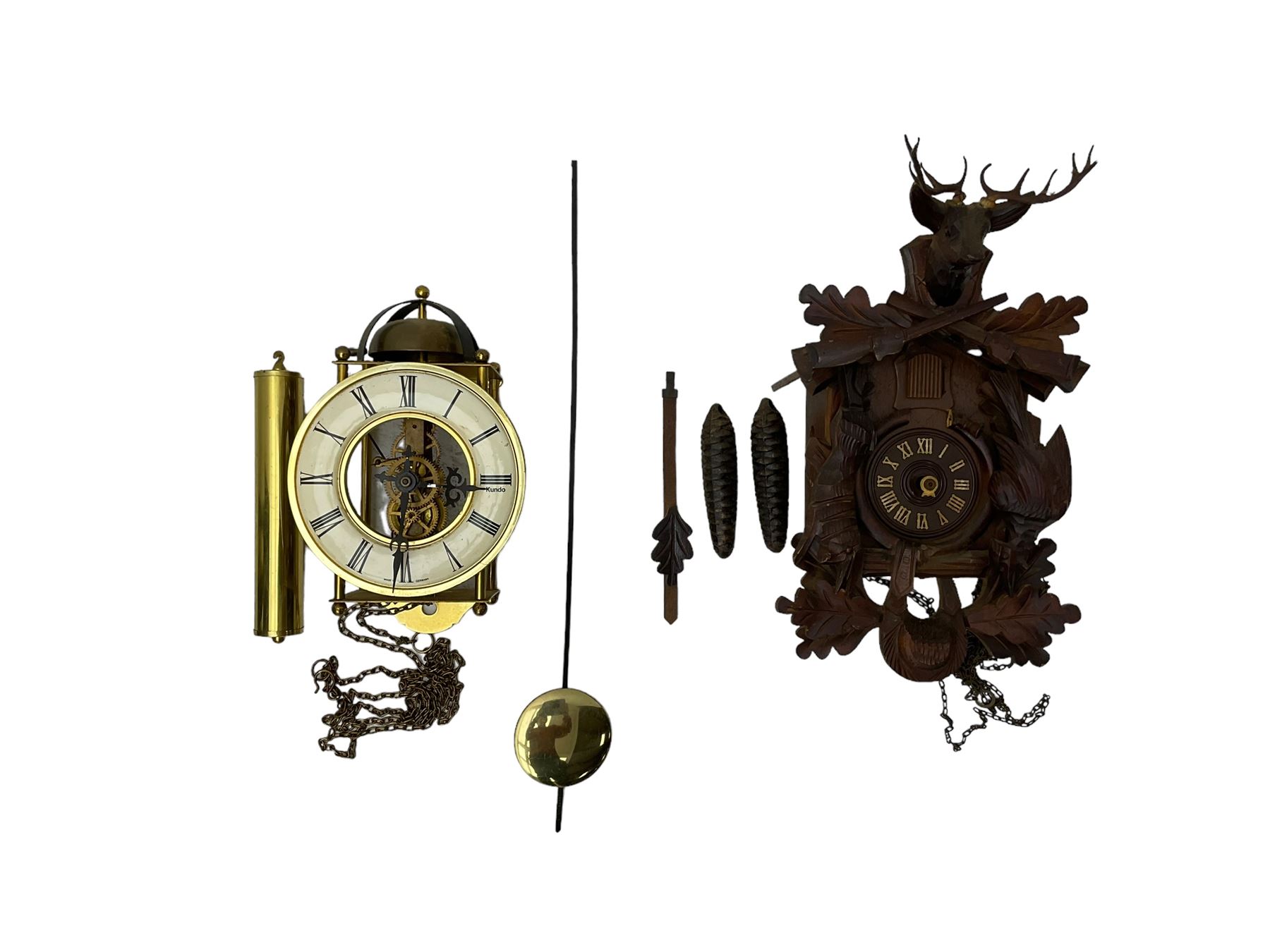 A 20th century cuckoo clock and weight driven German wall clock.