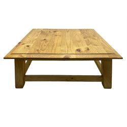 Pine coffee table, moulded top square top raised on splayed supports united by box stretchers 