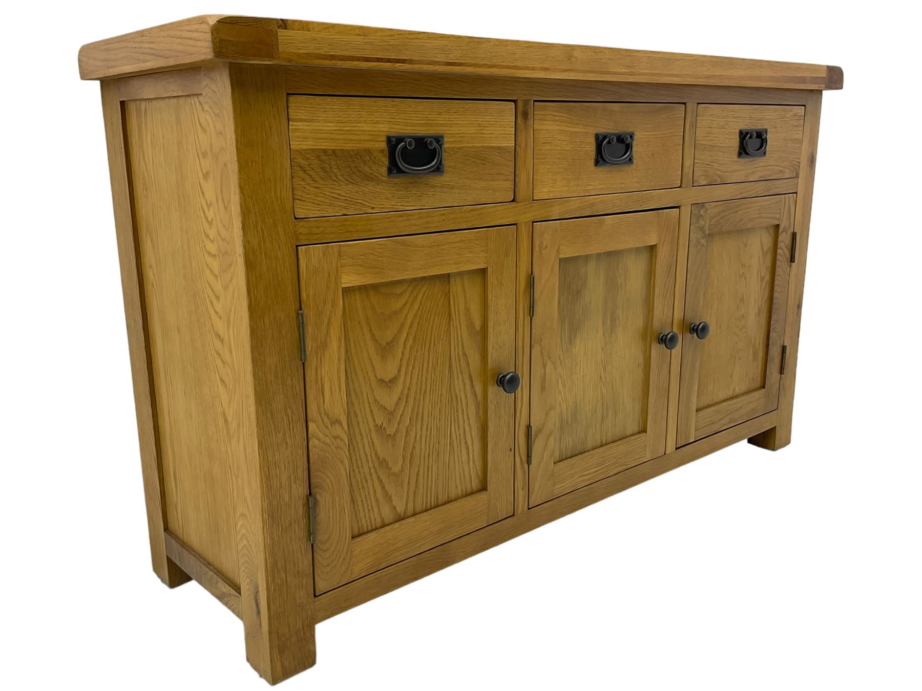 Contemporary light oak sideboard, fitted with three drawers over three panelled cupboards enclosing shelving, on square supports