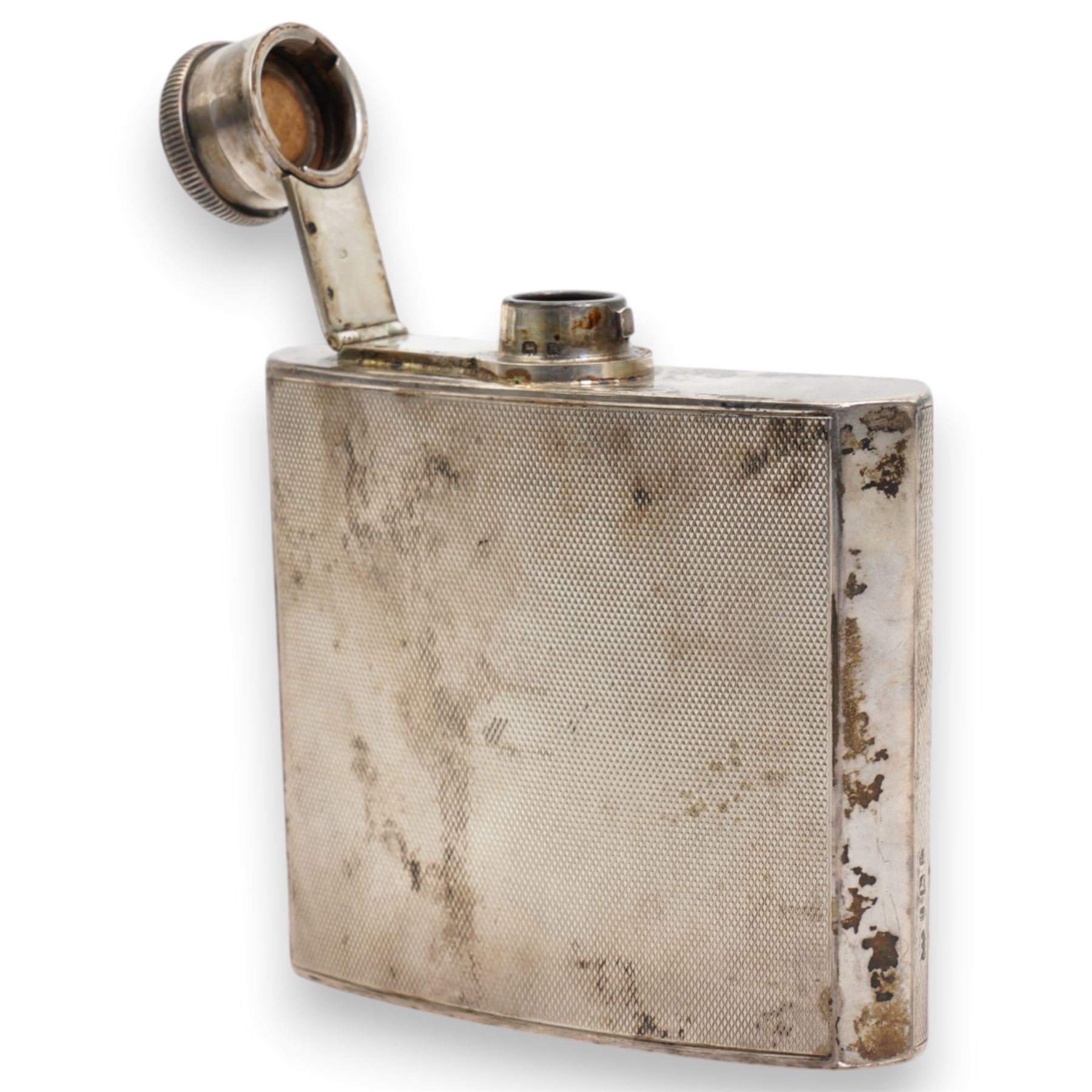 Engine turned silver spirit hip flask of concave outline 3/4 gill 9cm x 8cm  Birmingham 1934 Maker Henry Clifford Davis retailed by Ogdens of Harrogate and London  