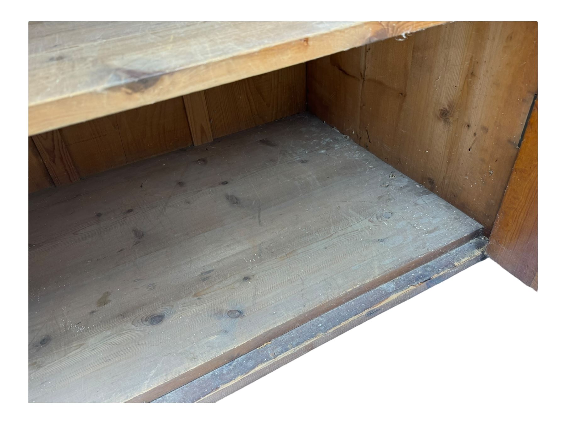 Large 19th century pine cupboard, rectangular top over two panelled later doors, enclosing four open shelves, on plinth base