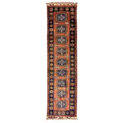 Late 20th century Afghan style ground runner, woven with a repeating panel design along a ...