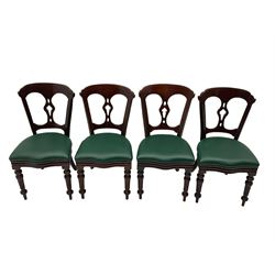 Matched set of twelve Victorian mahogany dining or boardroom chairs, the shaped cresting rail decorated with scrolled decoration, upholstered drop-on seats upholstered in green fabric, on turned supports  