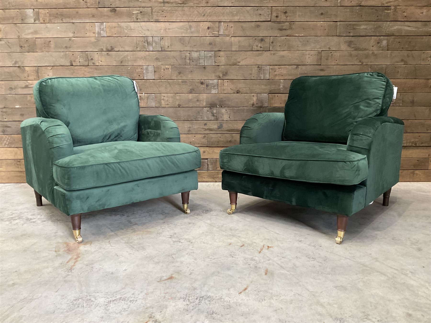 Pair of Howard design armchairs, upholstered in jade green velvet fabric