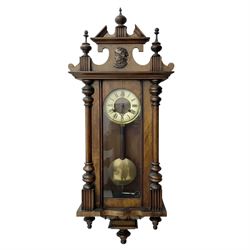 German- Late 19th century 8-day spring driven wall clock in a walnut and ebonised case, wi...