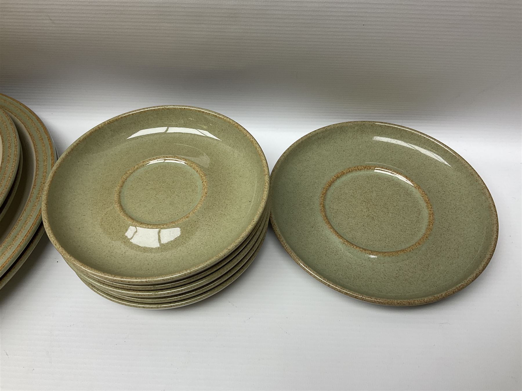 Denby tea and dinner wares, including bowls, jugs, tureens, side plates, dinner plates, serving dishes, cups and saucers, coffee pot, etc, all decorated with a green and brown mottled glaze, with printed marks beneath, in two boxes 