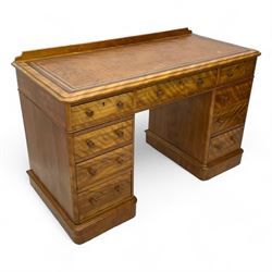 Victorian satin walnut twin pedestal desk, moulded rectangular top with rounded corners and raised back, inset leather writing surface with tooled borders, fitted with nine drawers with turned handles, on moulded plinth base 