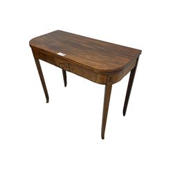 George III mahogany D-end tea table, fold-over top over figured frieze with geometric stringing, on square tapering supports with splayed terminals 