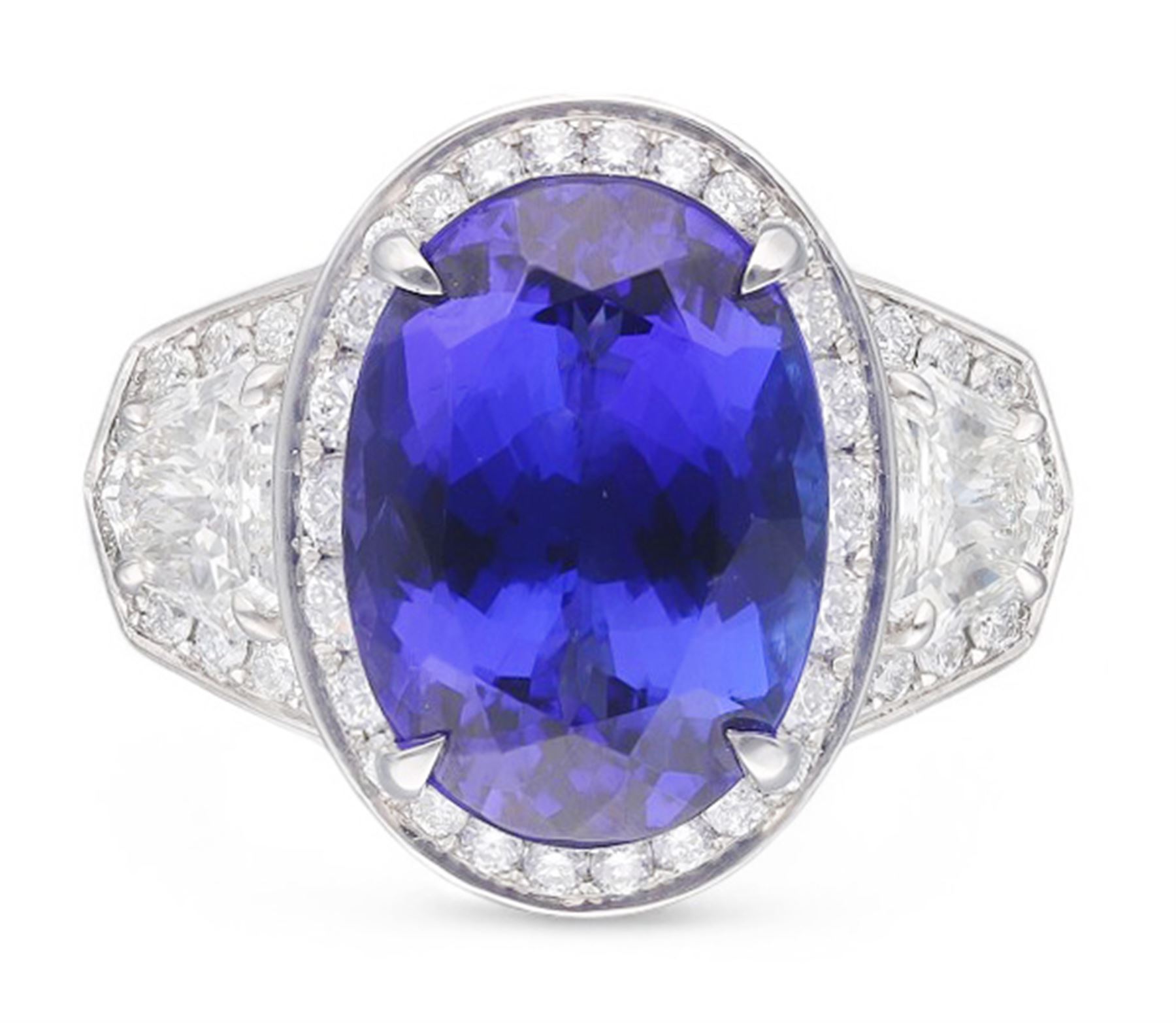 Platinum tanzanite and diamond ring, oval cut tanzanite, with round brilliant cut diamond surround, each side flanked by a single bullet cut diamond, with round brilliant cut diamond surround, hallmarked, tanzanite 9.16 carat, bullet cut diamonds 0.95 carat, round brilliant cut diamonds 0.83 carat