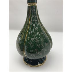 Royal Worcester vase of baluster form with floral decoration on a green ground H26cm