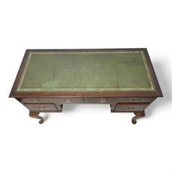 Early 20th century kneehole desk, moulded rectangular top with green leather inset, fitted with four drawers, on cabriole supports