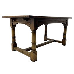 Oak refectory dining table, rectangular three plank top with cleated ends, two additional leaves, on turned supports united by H-stretchers 