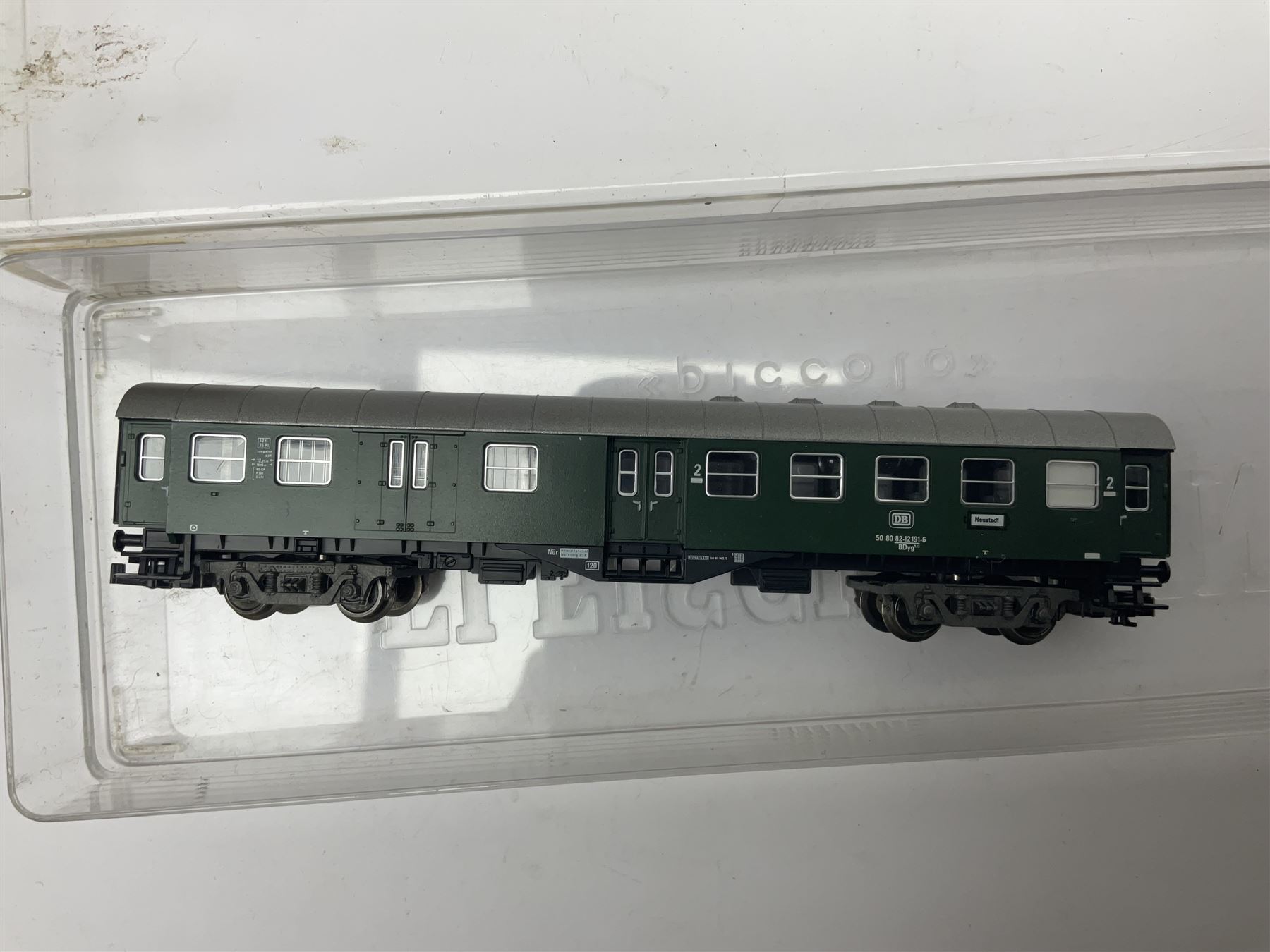 Fleischmann ‘N’ gauge ‘Piccolo’ - sixteen carriages, wagons and cars comprising nos. 8051, 8052, 8055, 8064, 8119K, 8127, 8128, 8129, 8202, 8211, 8224, 8240, 8281, 8301, 8500, 9372; along with Minitrix N503 Shock Van and 13576 6 ton Mineral Wagon; boxed and loose (18) 