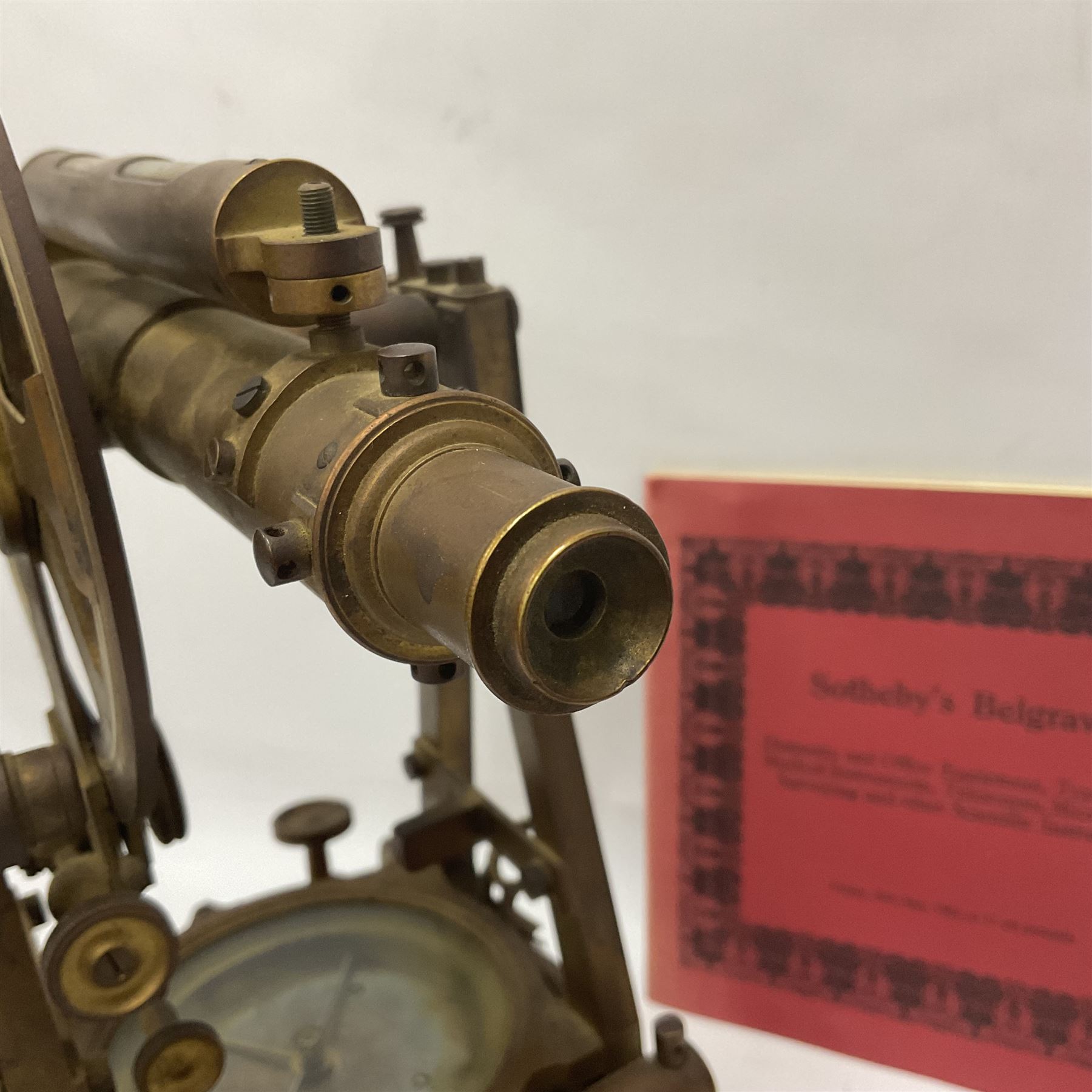 19th century brass transit theodolite by Troughton & Simms, the sighting telescope with rack and pinion focusing, above an inset compass, upon four levelling feet and a rectangular wooden base, including base H35.5cm