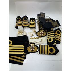 Royal Navy Lieutenant's Frock Coat by Haycock and Jarman, together with other naval accessories, including four pairs of Captain's insignia, six pairs of Captain's shoulder boards, a Merchant Navy cap badge and a collection of other badges, buttons and shoulder boards 