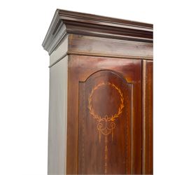 Edwardian inlaid mahogany wardrobe, projecting moulded cornice over central bevelled mirror glazed door, panelled uprights inlaid with trailing bellflowers and foliate decoration, the skirted base fitted with single drawer 