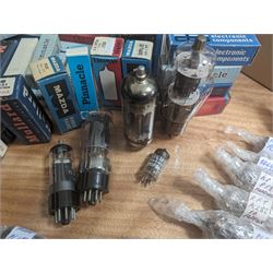 Large collection of thermionic valves/vacuum tubes, by various makers, mostly wrapped in bubble wrap with identifying stickers, together with a collection of empty valve boxes including Pinnacle, Mullard etc