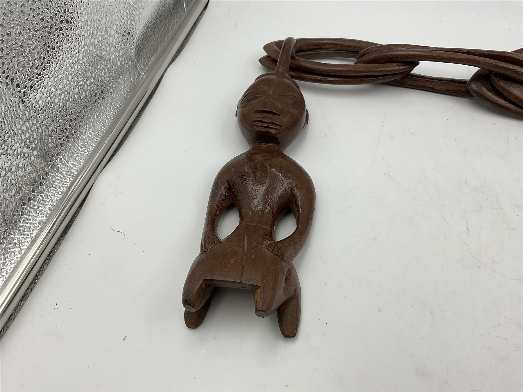 African carved wooden marriage/wedding chain, together with three carved figures, largest H44cm