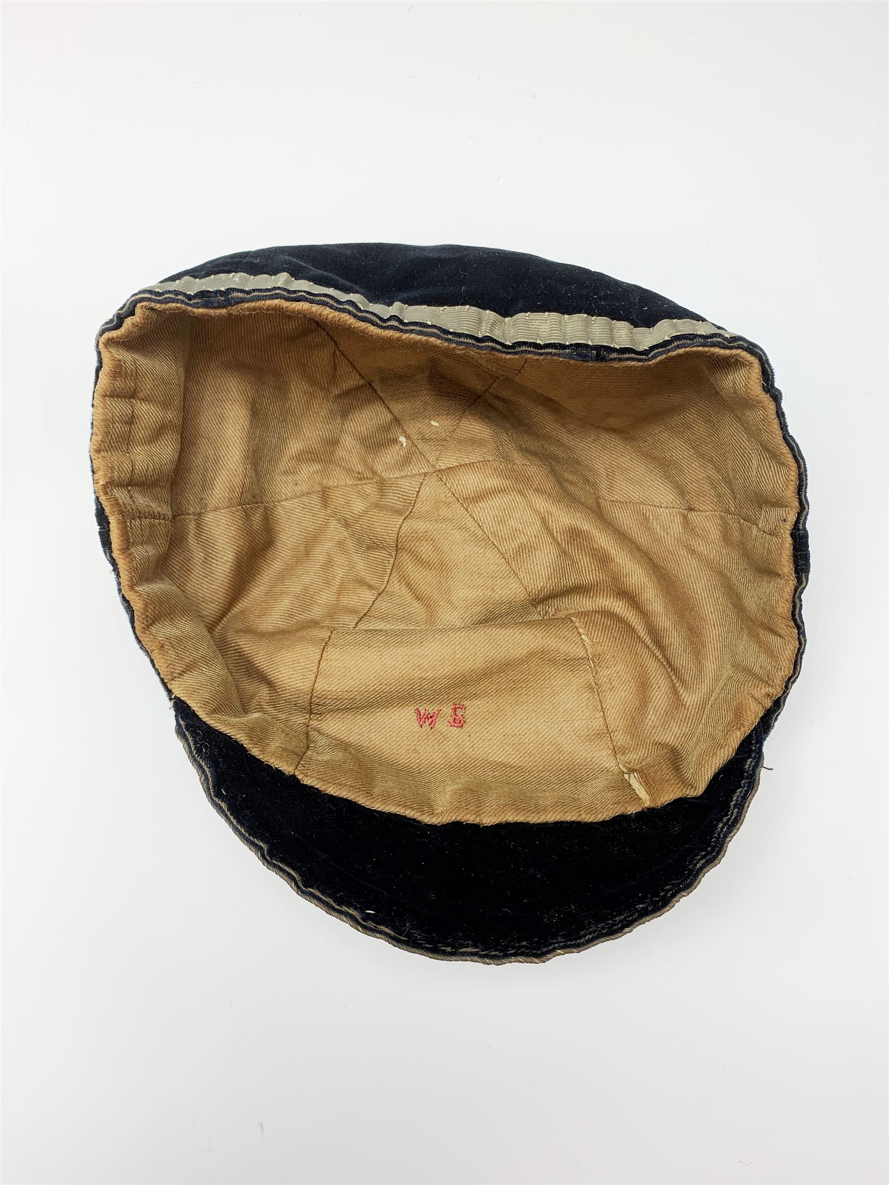 A Victorian rugby cap for Cumberland, the black velvet cap with gold coloured thread and tassel, dated 1888. 