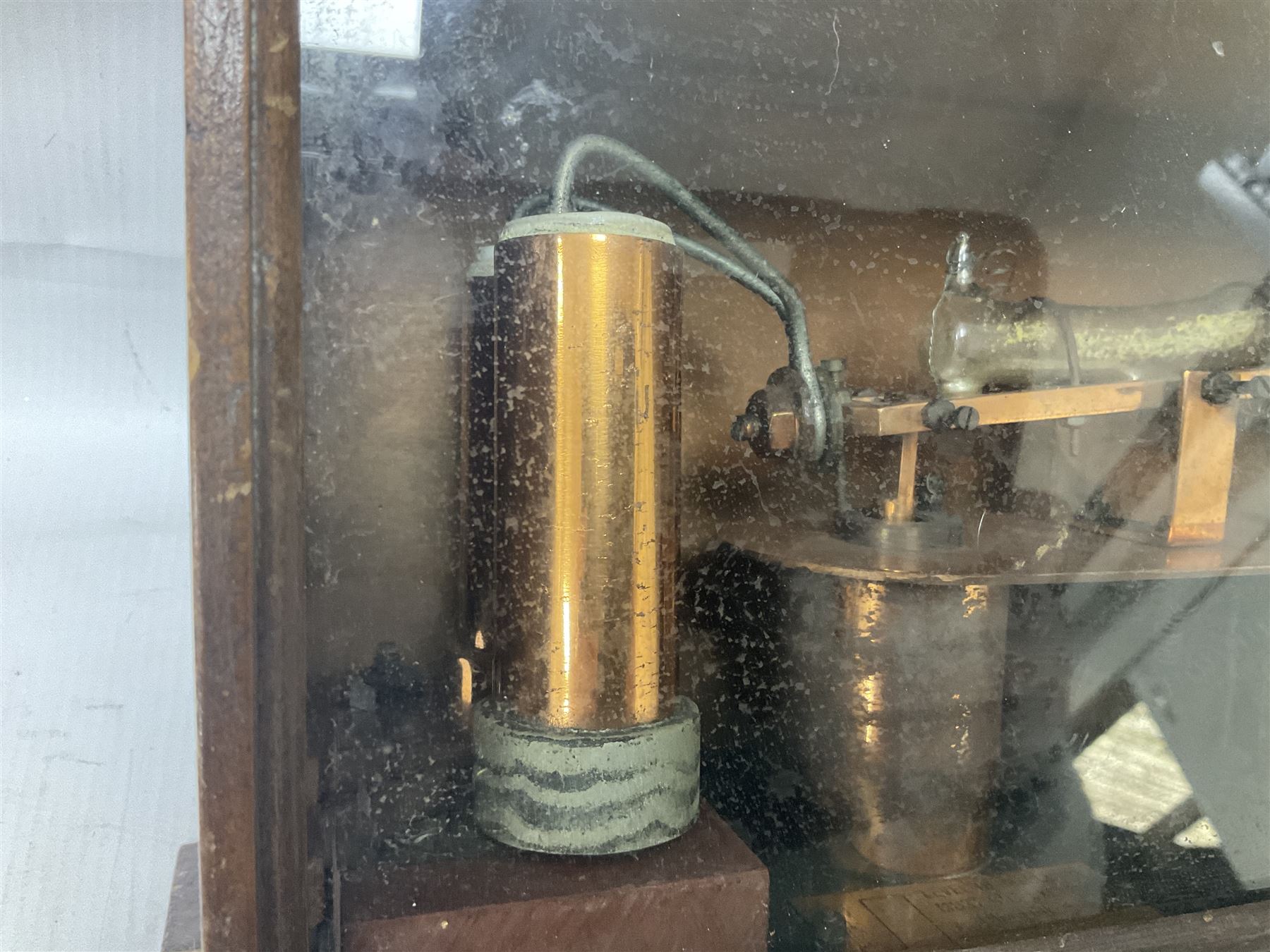 Early 20th century Automatic Temperature Control System, the polished copper body supporting a tube of liquid mercury, patent no 5311 dated 1912, attributed to John Grundy, within wooden box with glazed front panel, box H18.5cm