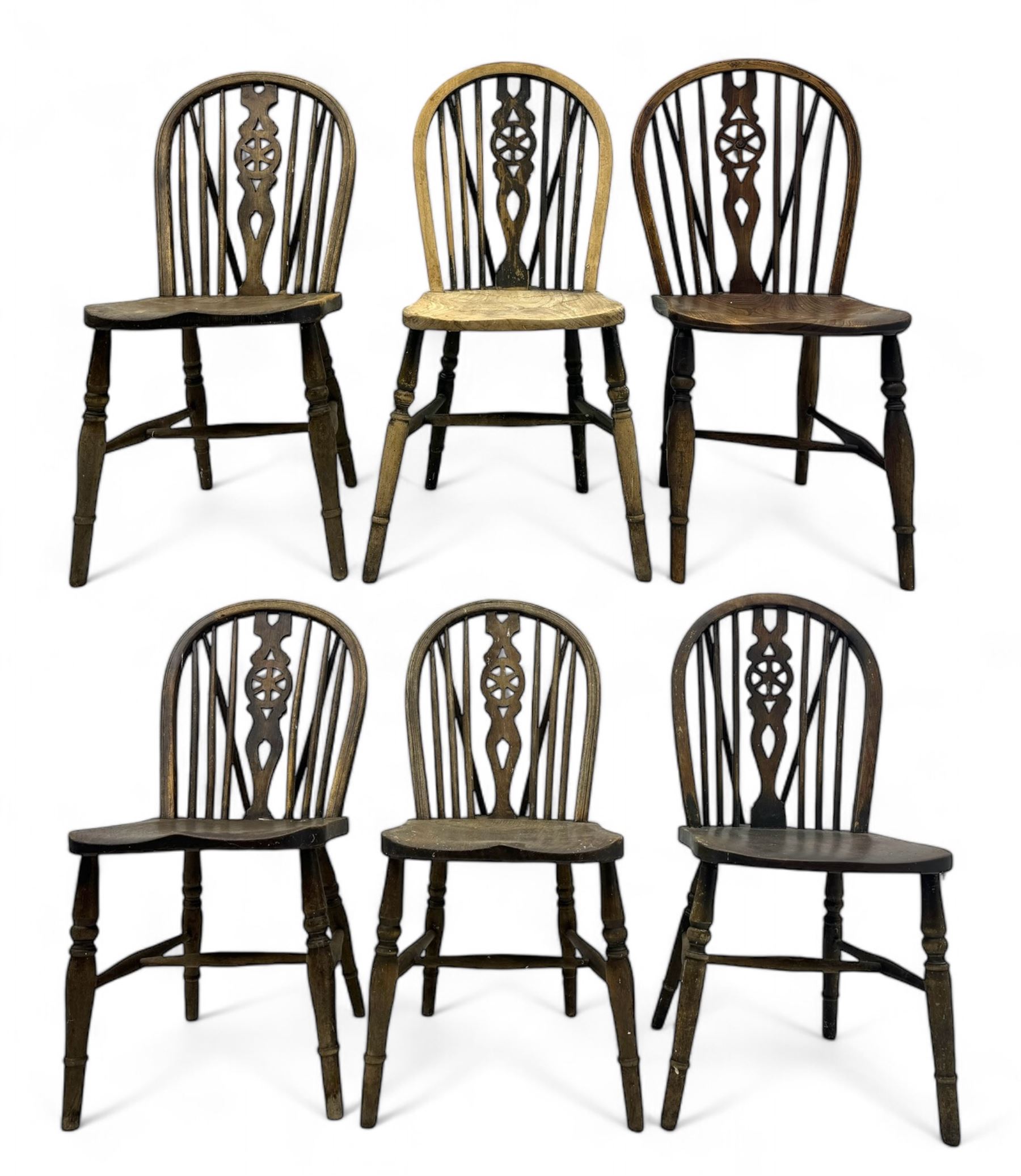 Mid-to-late 20th century set of six elm and beech Windsor dining chairs, hoop and stick back with pierced wheel splat, dished elm seat, on turned supports united by turned stretchers 