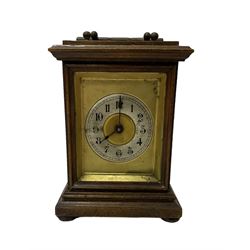 Assortment of three mantle clocks and an aneroid barometer.