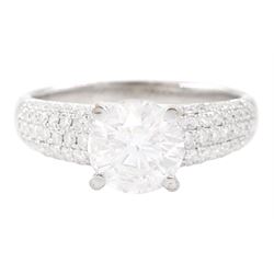 18ct white gold single stone round brilliant cut diamond ring, with pave set diamond shoul...