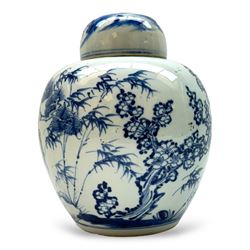 Chinese blue and white ginger jar, decorated with blossoming trees and a figure in a lands...