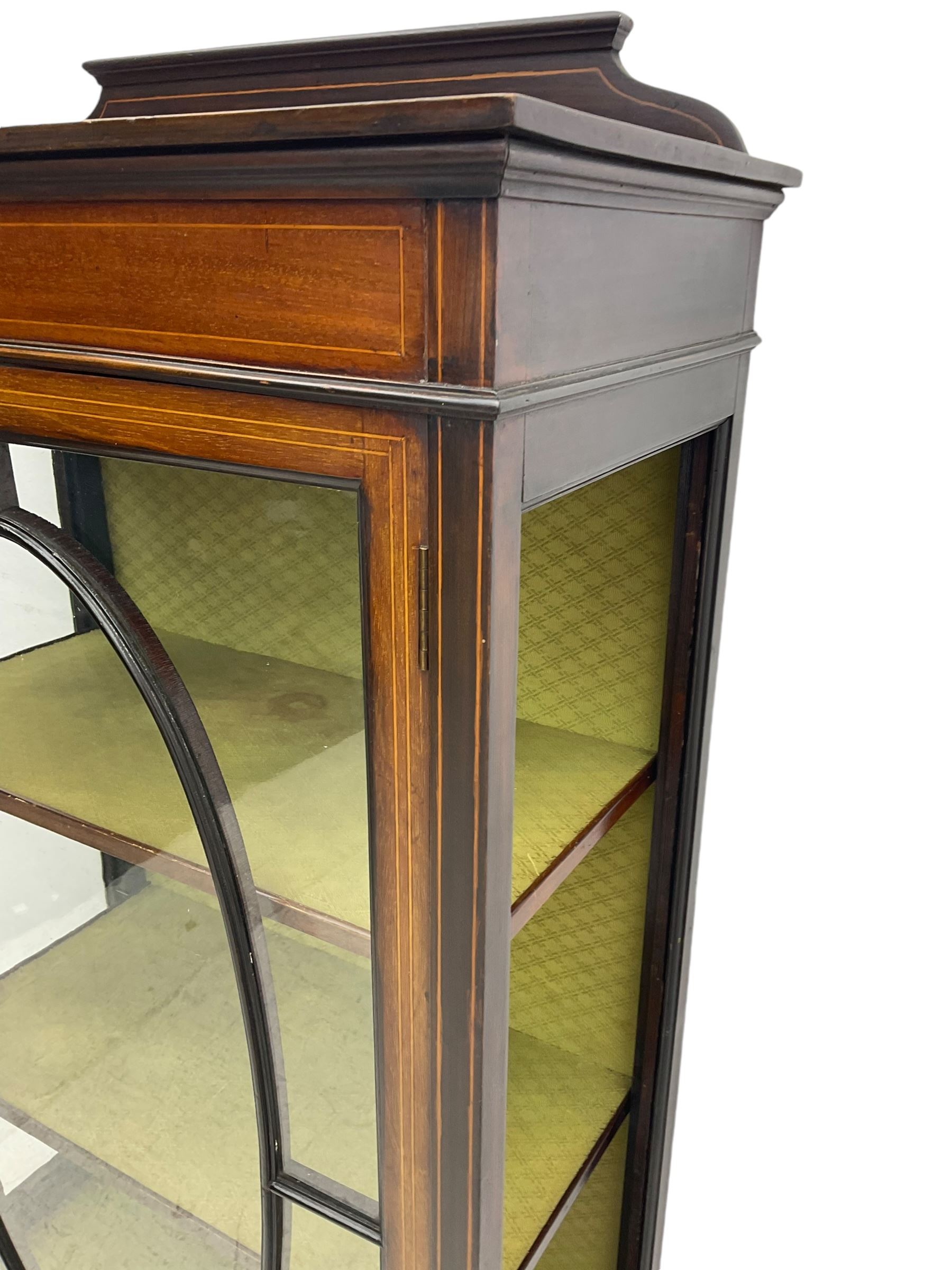 Edwardian inlaid mahogany display cabinet, shaped and raised back over single astragal glazed door, interior lined and fitted with two shelves, raised on square tapering supports