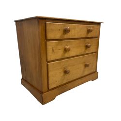 Victorian pine and satinwood chest, fitted with three graduating drawers, on skirted base with castors