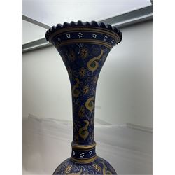 Large and unusual terracotta floor vase, of ovoid form with tall flared neck with frilled rim, decorated with stylised foliate motifs in gilt upon a dark blue ground, H89cm