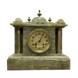 French-early 20th century 8-day onyx mantle clock with a gilt metal dial and rack striking movement.