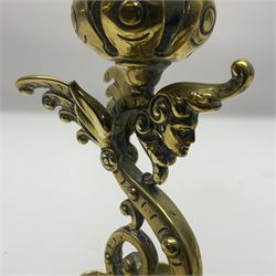 Pair of Victorian brass candlesticks by Adolf Frankau & Co, each with pierced sconce upon a scrolling stem with winged mask decoration, the lobed drip pan embossed with masks and upon three scrolling feet, stamped with maker's mark beneath, H18cm