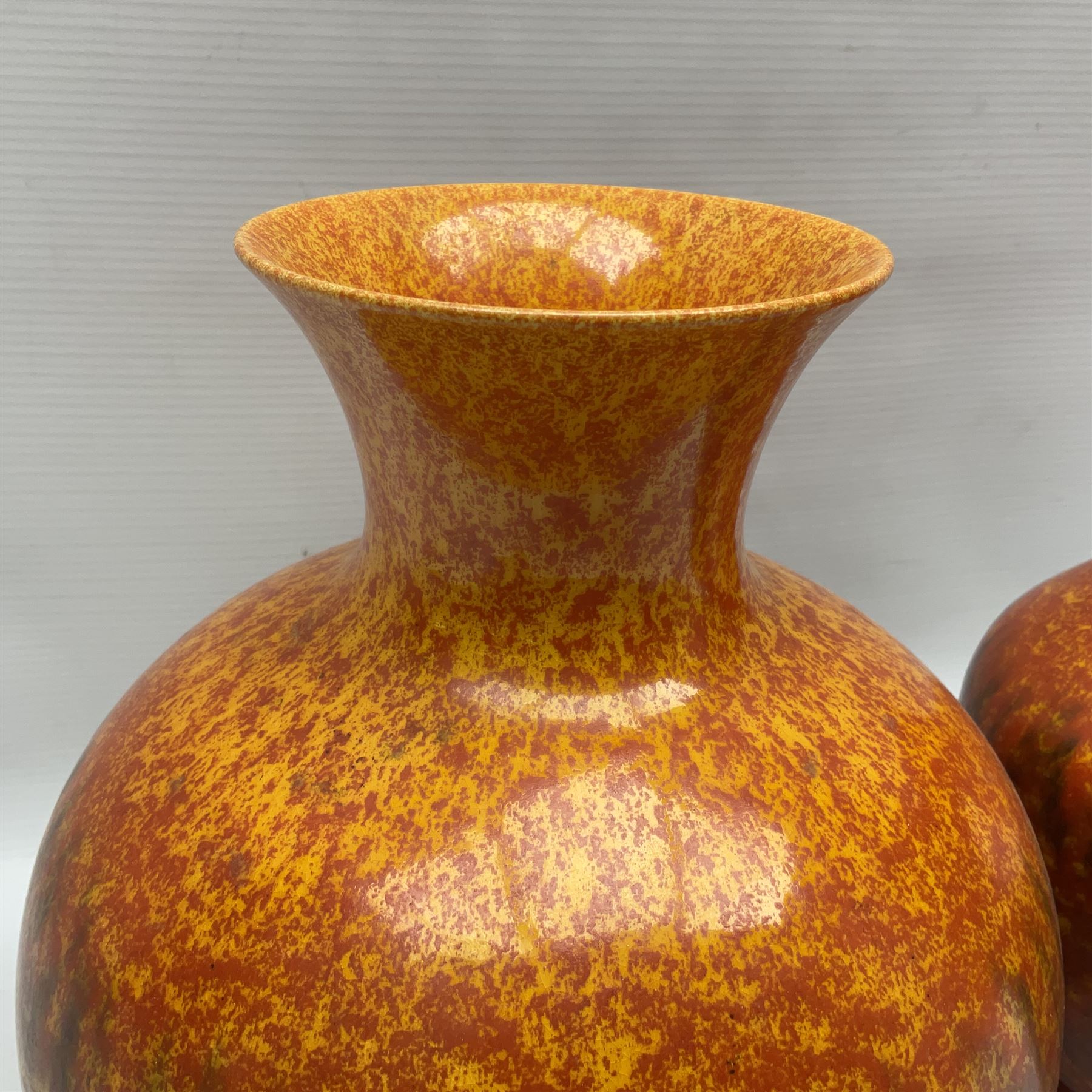 Two Pilkington's Royal Lancastrian vases of baluster form decorated in orange Vermillion, larges H27cm