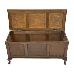 Early 20th century oak blanket chest, rectangular hinged lid with decorative panelling, the front and sides adorned with beaded panels, on cabriole feet