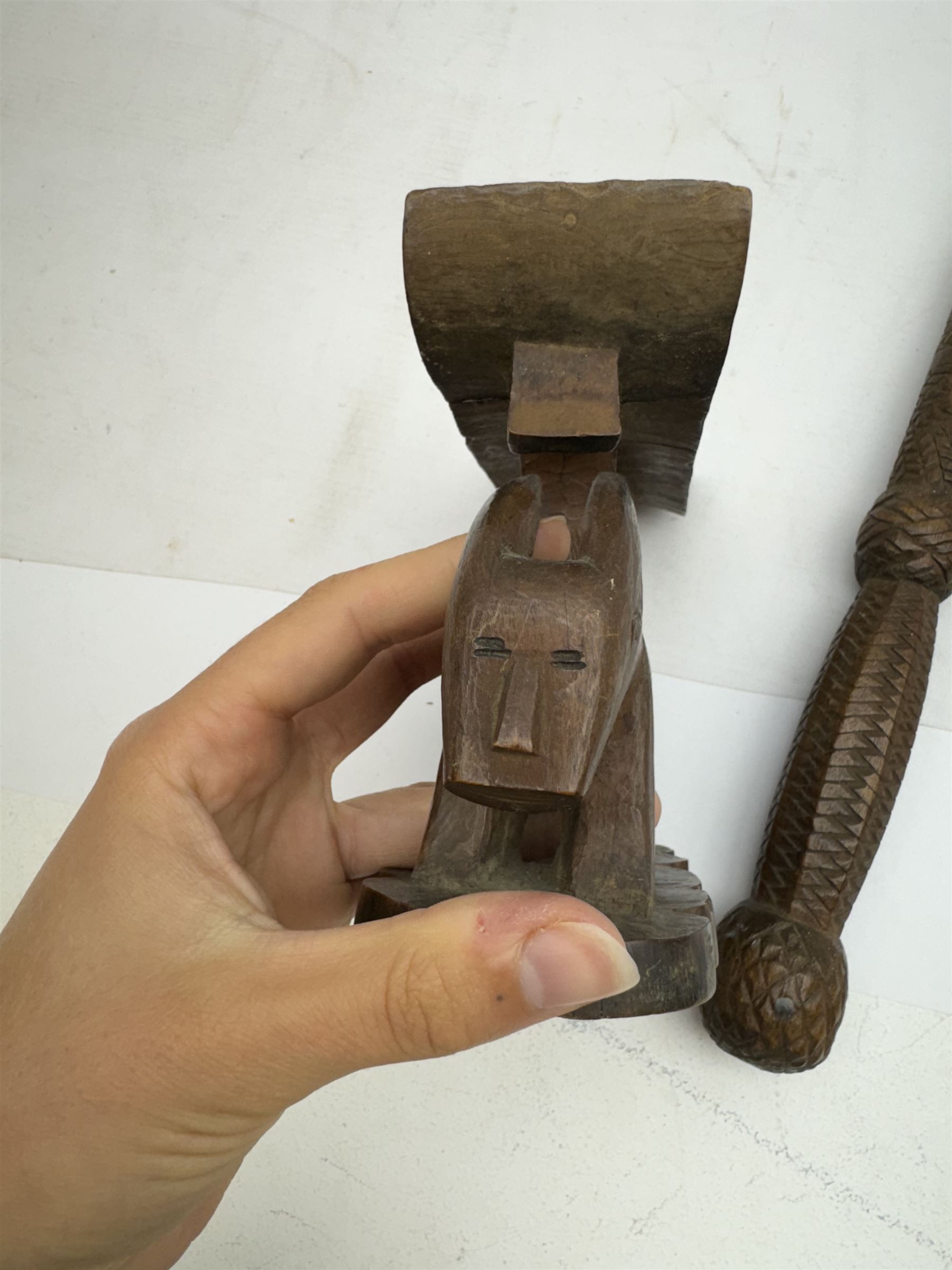 African carved head rest, modelled as an animal, and a similar carved baton, head rest H13cm