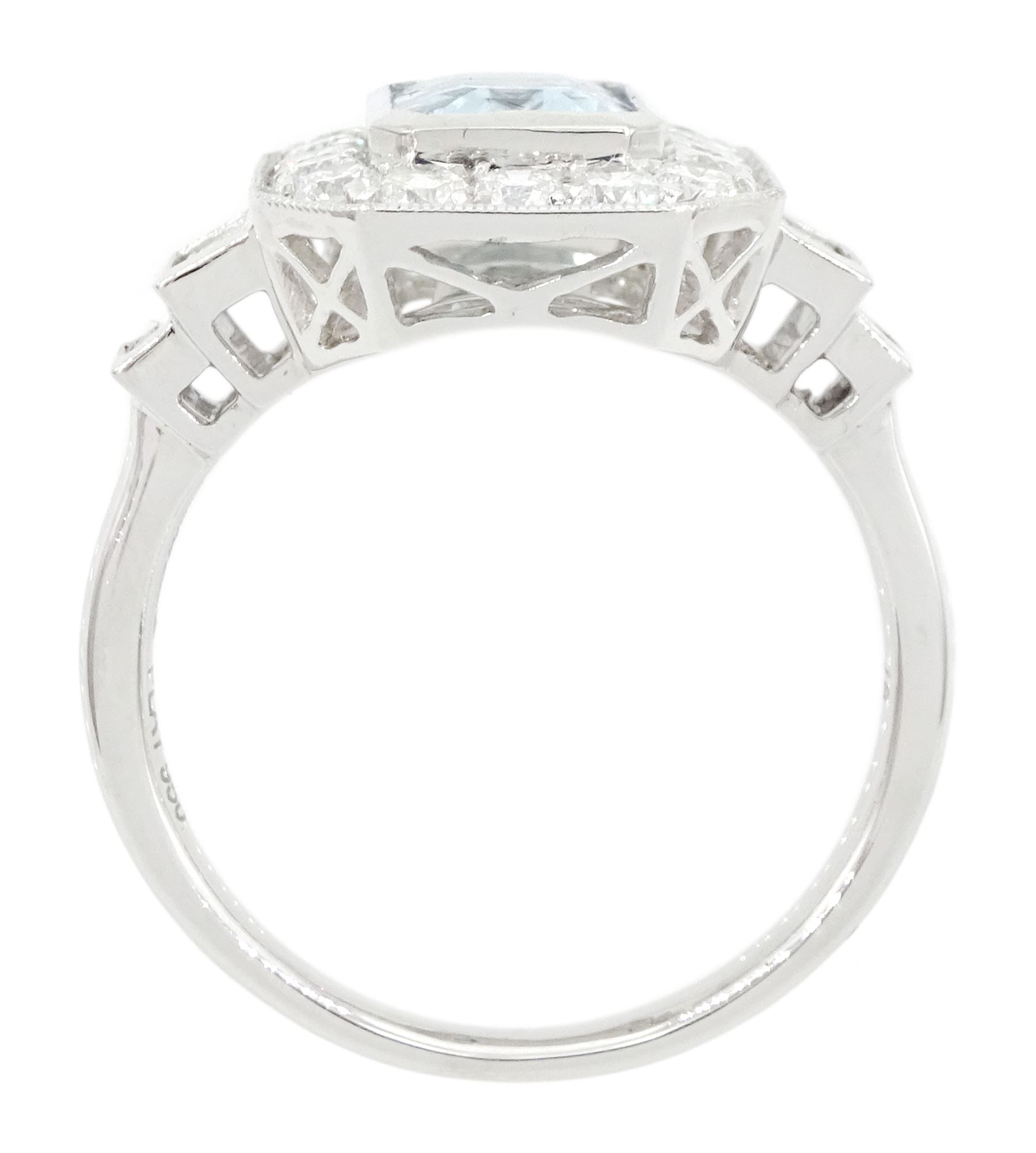 Platinum aquamarine and diamond cluster ring, emerald cut aquamarine of approx 1.40 carat, with milgrain set round brilliant cut diamond surround, each side set with two baguette cut diamonds, hallmarked, total diamond weight approx 1.10 carat