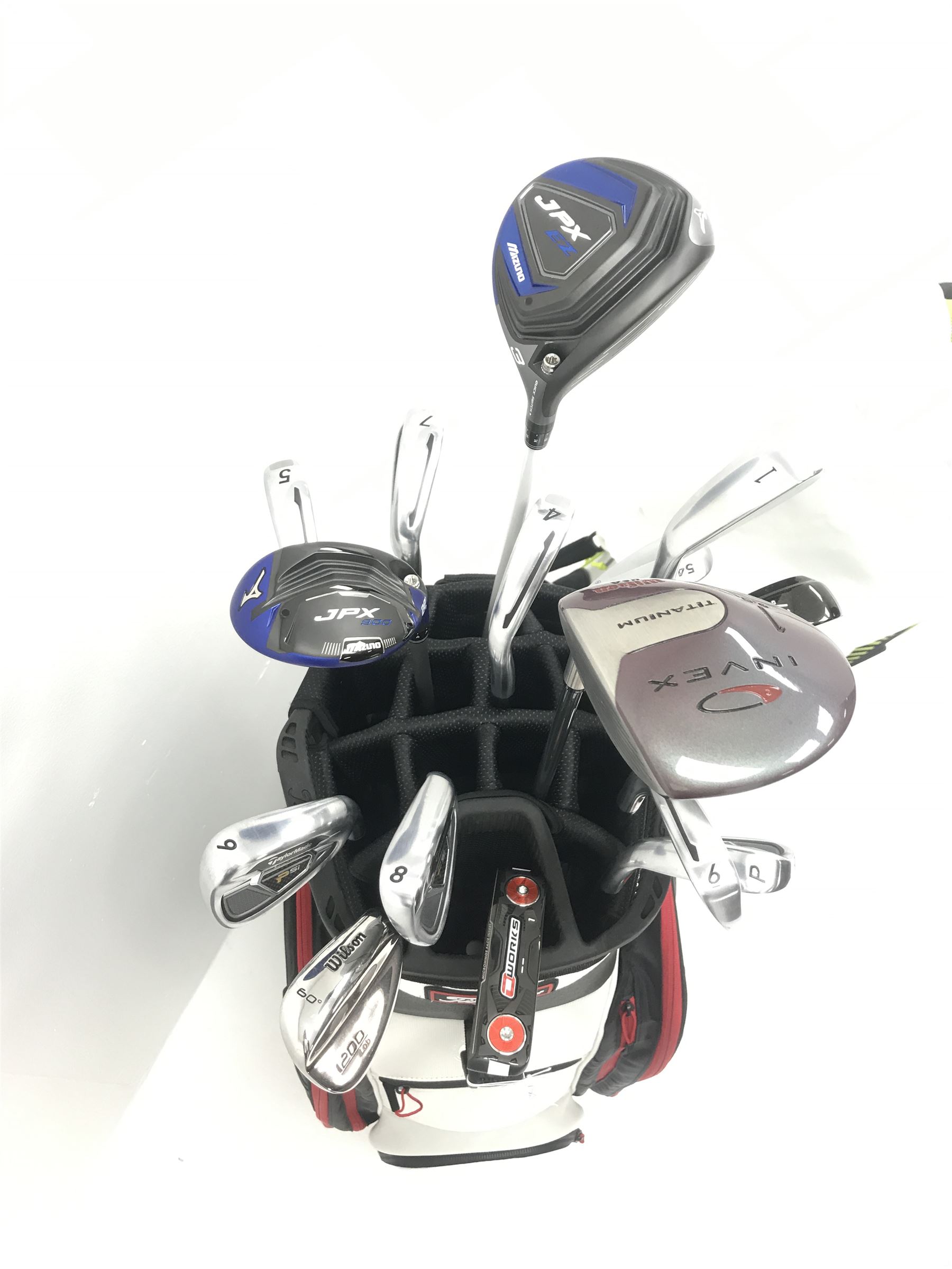 A quantity of TaylorMade golf clubs and others and two bags 