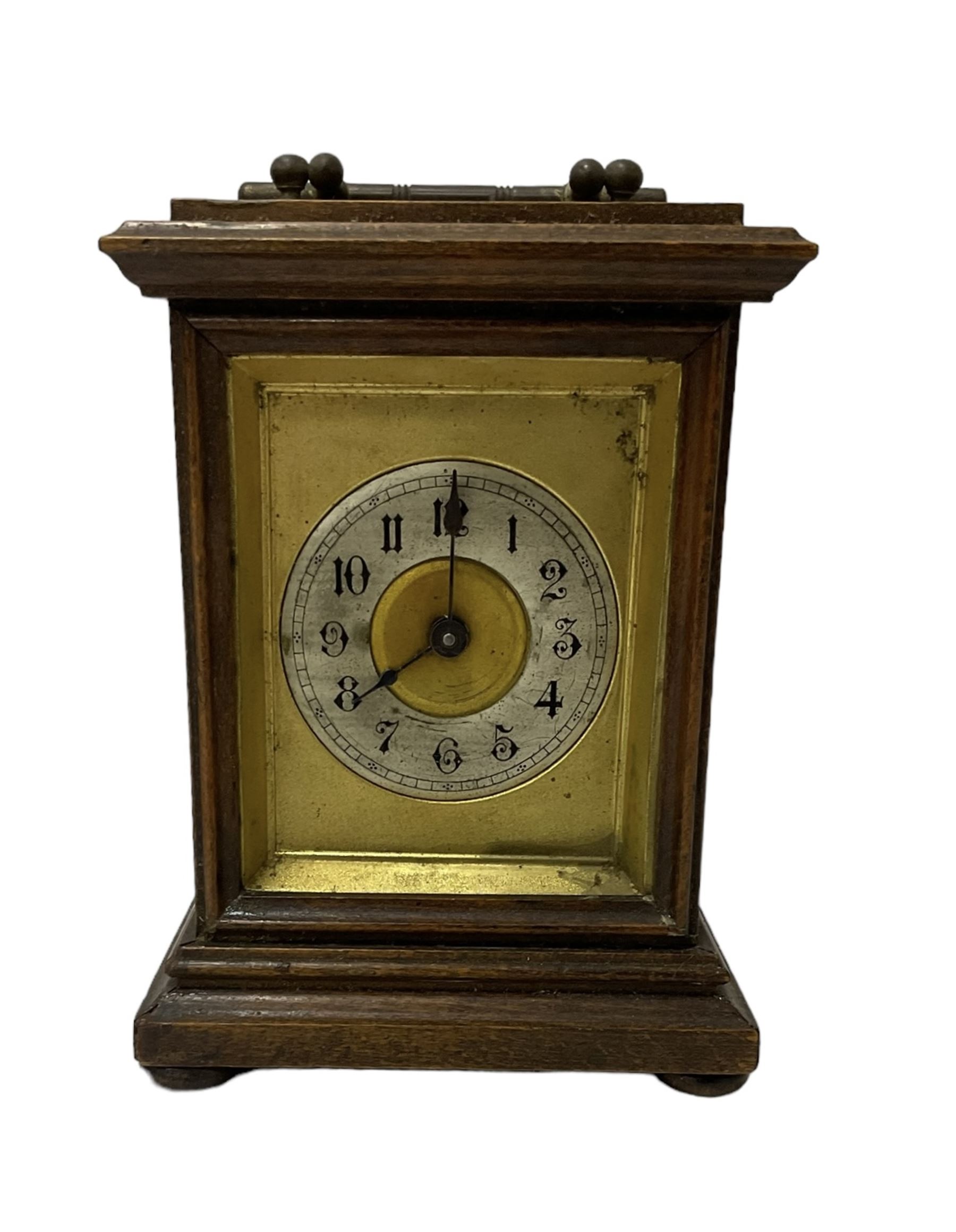 Assortment of three mantle clocks and an aneroid barometer.