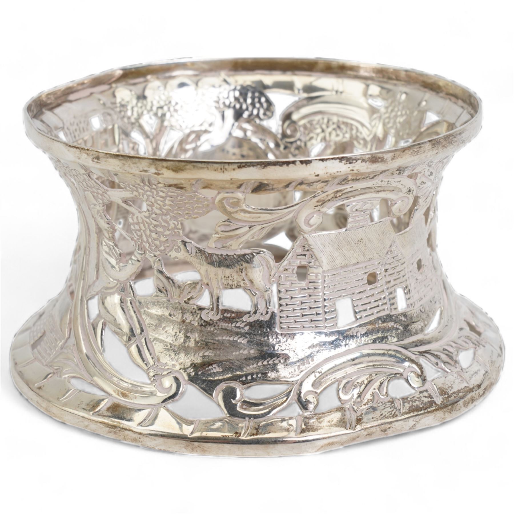 Silver miniature presentation dish ring, pierced and engraved with a pastoral scene, engraved 'Ganton Golf Club, J.T. Roop, 1914, hallmarked Wakely & Wheeler, Dublin 1913, H6cm, D11cm