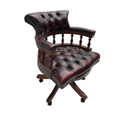 Victorian design Captains swivel desk chair, tub shaped balustrade back, upholstered in deep buttoned oxblood leather with studwork border