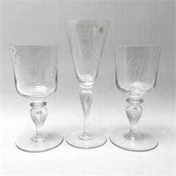 Three Whitefriars Royal Commemorative glasses, comprising two examples with bucket bowls etched with Royal ciphers and dates, upon baluster stems with internal tears and circular feet, one marked beneath W T Wilson no1080, the other G Baxter no 86; and a third example with funnel bowl also etched with Royal cipher and date, upon a baluster stem with internal tear and circular foot, marked beneath G Baxter No 218, H23.5cm.