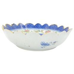 19th century/ early 20th century Chinese Canton blue and white bowl, centrally decorated with a landscape scene, within a famille rose enamelled border and scalloped rim, D26cm together with a Japanese Meiji Imari fluted bowl, decorated cranes, fans and scholar, D24cm (2)