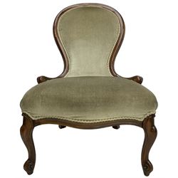 Victorian design nursing chair, moulded spoon back upholstered in green fabric, on scroll carved cabriole feet