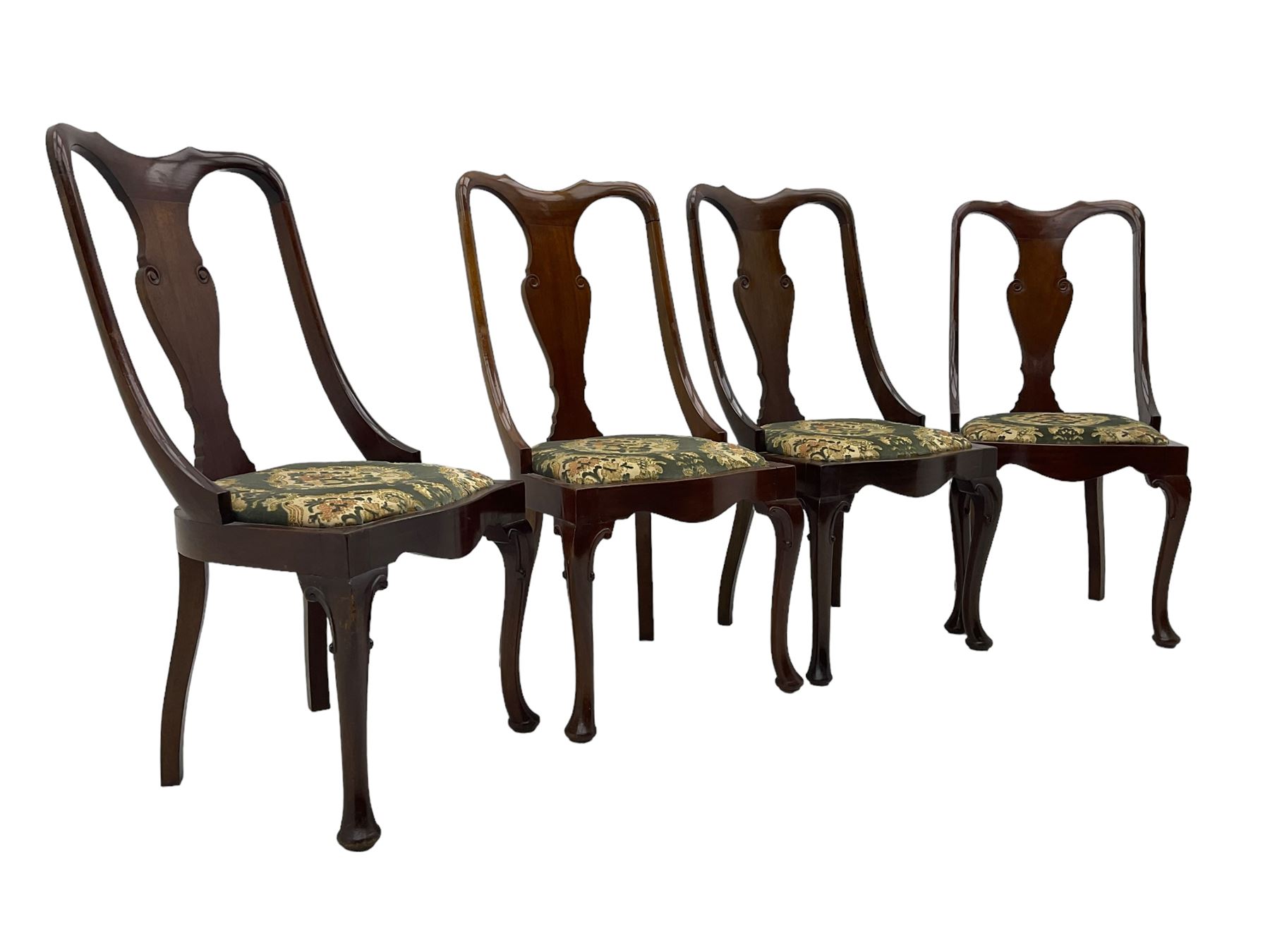 Set of eight late 19th century mahogany spoon back dining chairs, each with shaped top rail over Queen Anne design vase-shaped splat, upholstered seats in floral patterned fabric, raised on cabriole supports with scroll carved knees