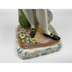 Large pair of late 19th century Continental figures in the Meissen style, modelled as a gardener and companion in 18th century dress, holding baskets of flowers and posies, each upon naturalistically modelled floral encrusted square base with scroll moulded sides, with underglaze blue cross sword type marks beneath, tallest example H49cm